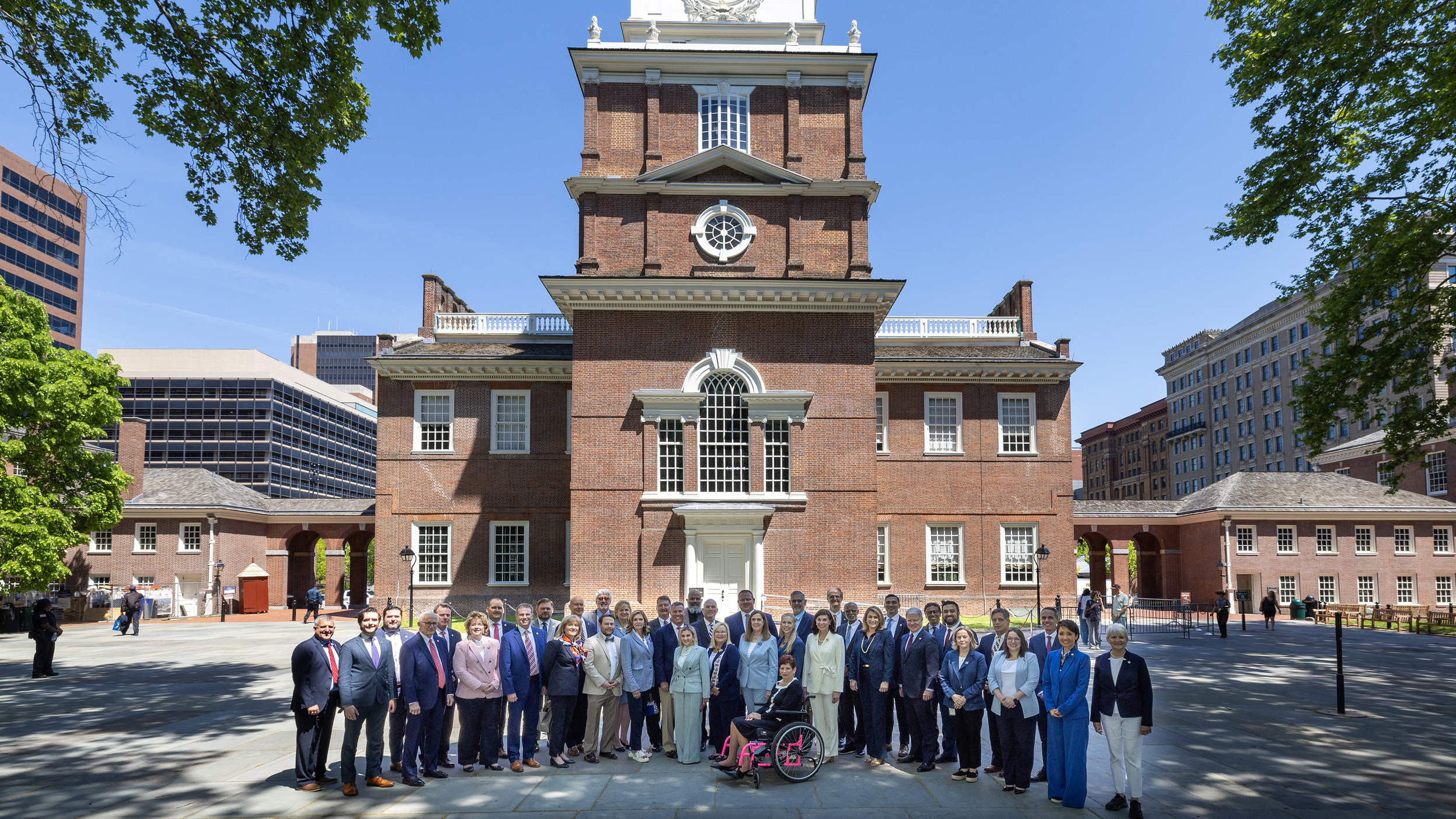The image features the full Senate delegation standing outside in front of the National Constitution Center in Philadelphia, PA.