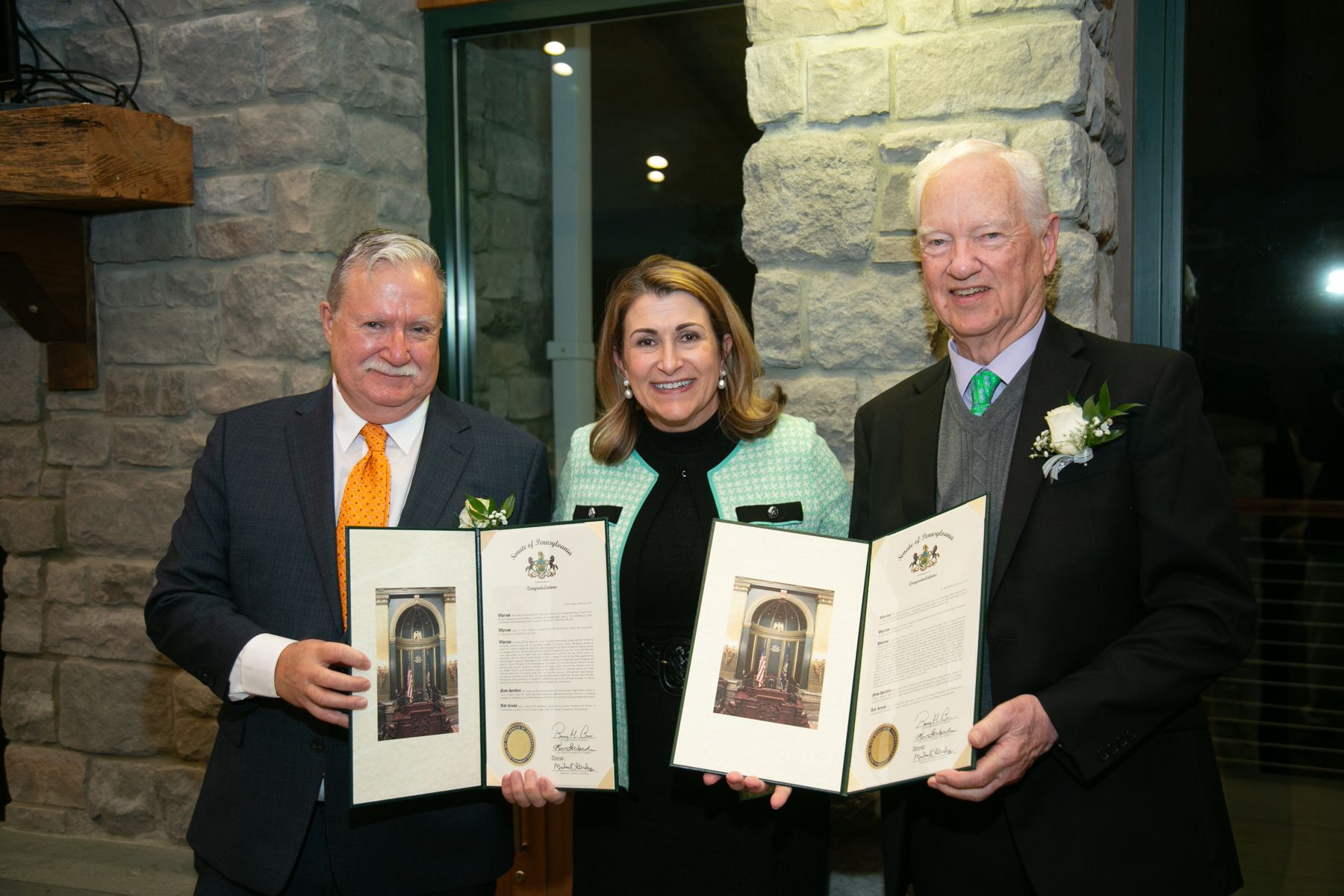 Sen. Rosemary Brown takes a picture with two of the honorees for the Monroe County Bar Association’s 50-year membership. They are posing in front of the window looking onto Trout Lake.
