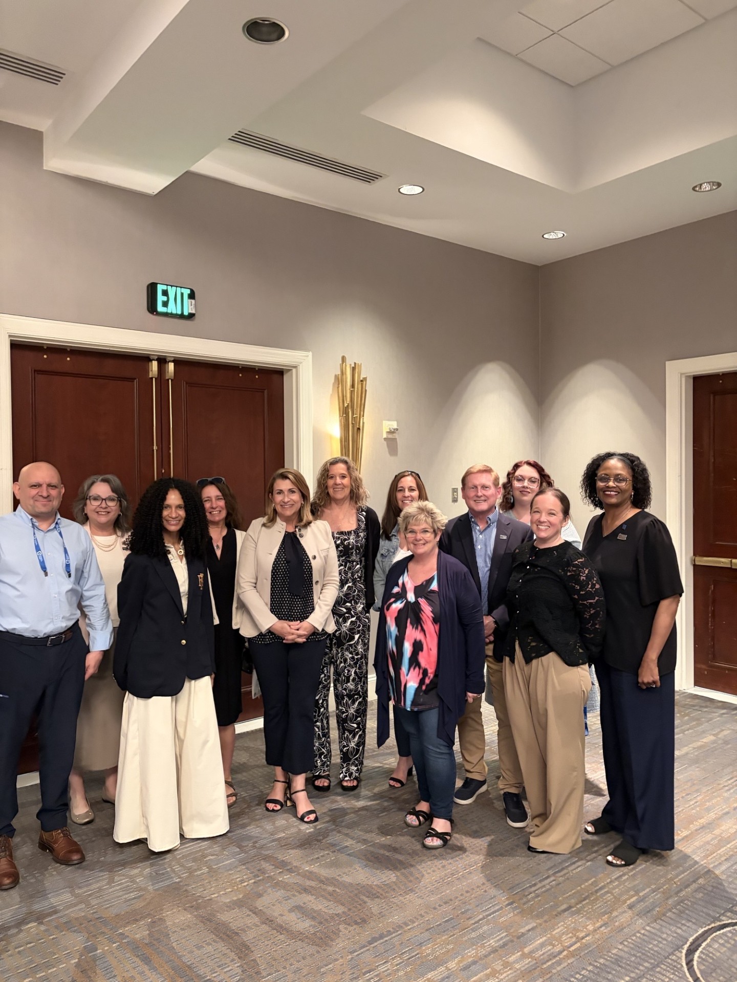 Sen. Rosemary Brown poses for a photo with members of the Pennsylvania Association of Realtors after speaking to them at their Harrisburg event.