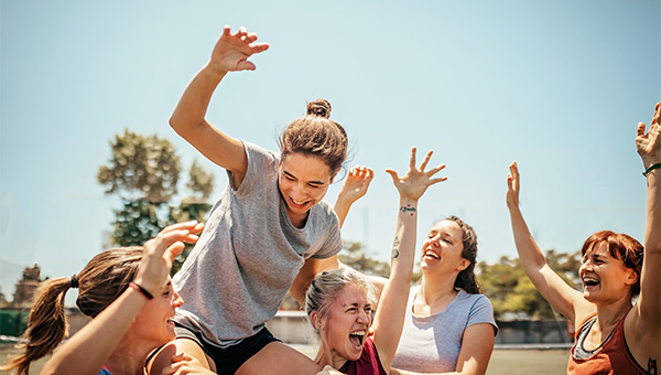 women playing sports cheering