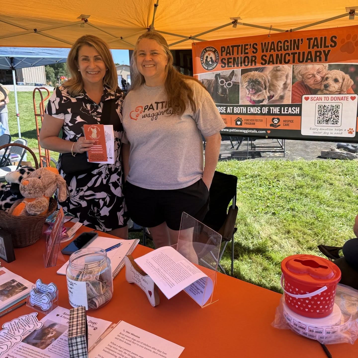 Sen. Rosemary Brown poses for a photo with Pattie’s Waggin’ Tails Senior Sanctuary at their table at Camp Freedom’s Annual Summer Salute Open House.